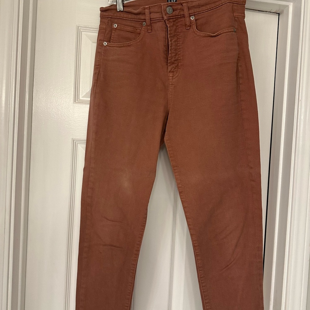 Women's Gap peachy/rust color straight leg jean.